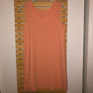 Peach scalloped dress.